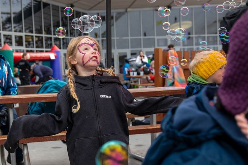 Children playing with bubbles.