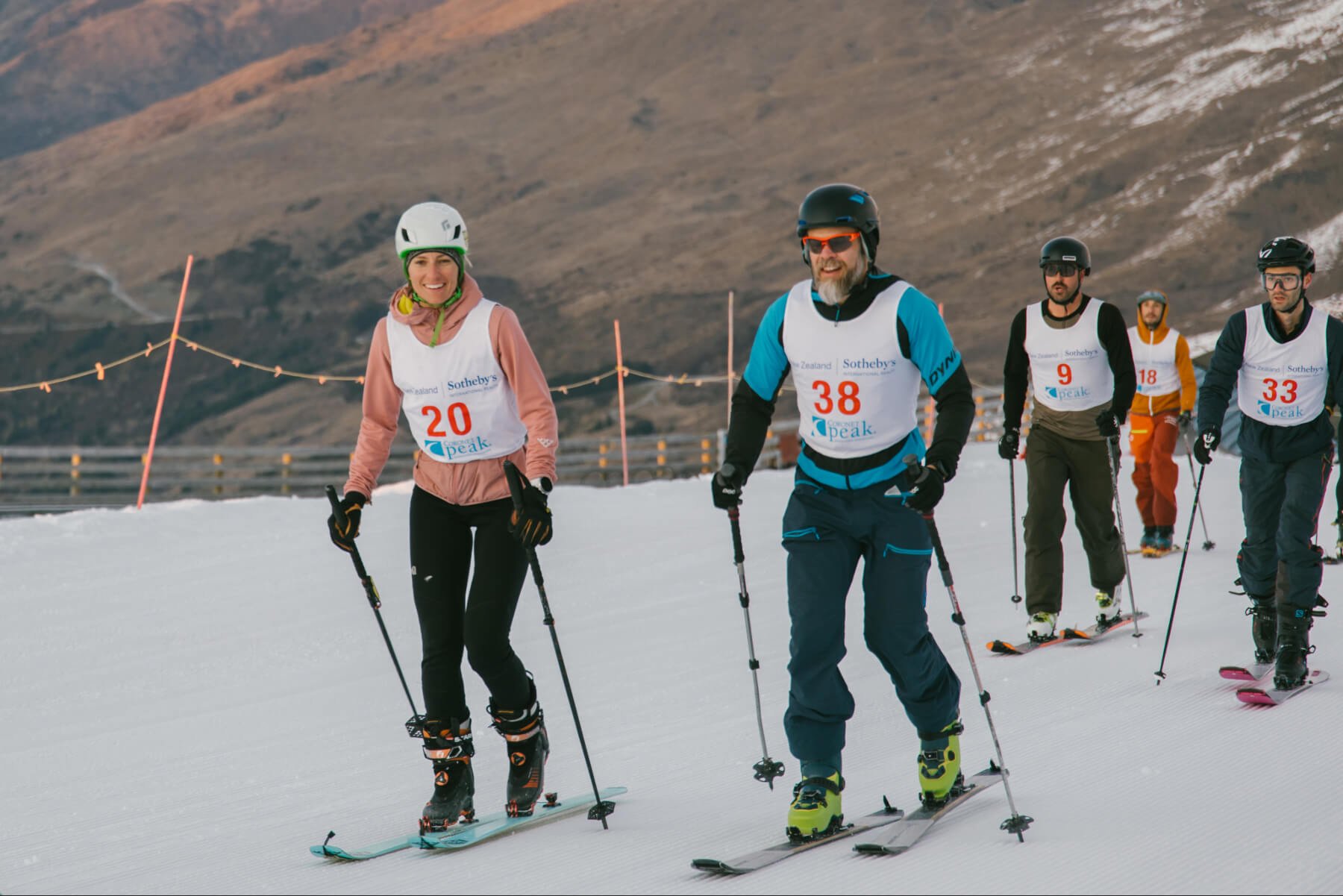 Skiers skinning up Coronet Peak.